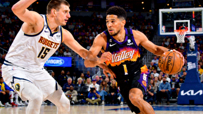 NBA常规赛太阳队对阵掘金队比赛图片，布克与约基奇